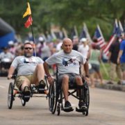 Veterans racing in wheel chairs in the 5k